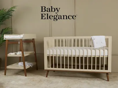 The Baby Elegance Ollie Cot Cream & Changing Table Unit Cream in a bright nursery room.