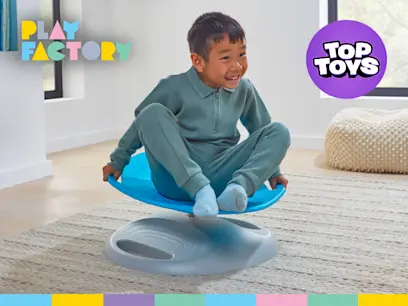 A kid playing on the Play Factory Sensory Spinning Chair blue in a bright room.