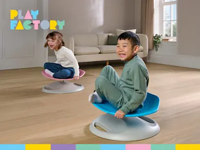 two different colour blue and pink of Play Factory Sensory Spinning Chairs and kids playing on the indoor background 