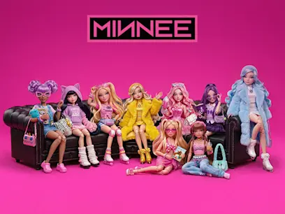 Group of nine fashion dolls posed on black sofas and floor against a bright pink background, with a "MINNEE" logo above. Dolls wear colorful trendy outfits, pastel hair, accessories, and fluffy jackets in pink, purple, yellow, and blue tones.