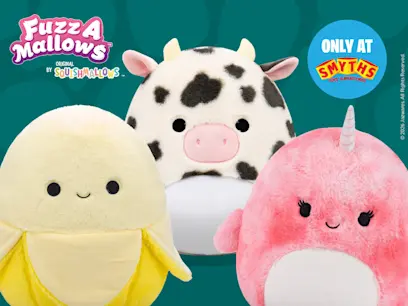 Three Squishmallows plush toys—a yellow banana, black-and-white cow, and pink unicorn—shown against a teal background. “FuzzAMallows” branding appears at top left, with a “Only at Smyths” badge at top right.