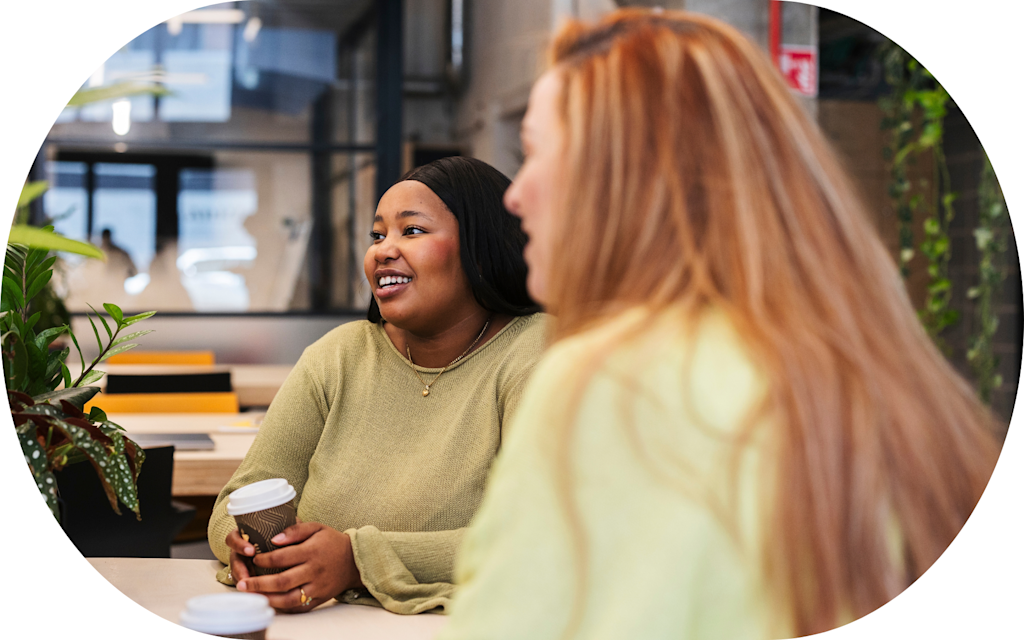 Two young women having coffee