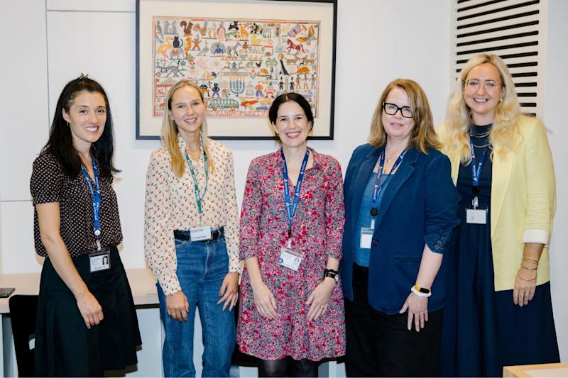 Four members of Anna Freud staff smiling and looking directly at the camera.