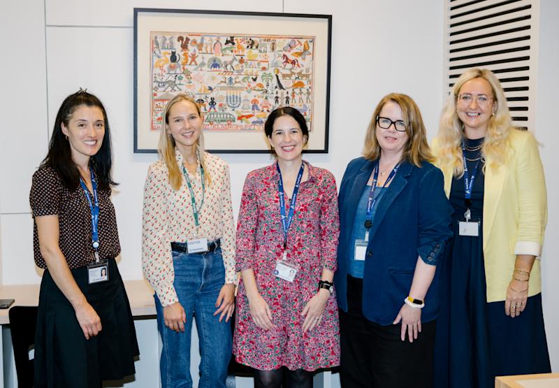 Four members of Anna Freud staff smiling and looking directly at the camera.
