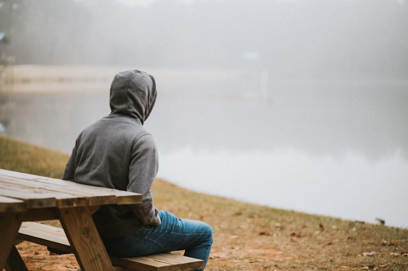 man sitting on bench
