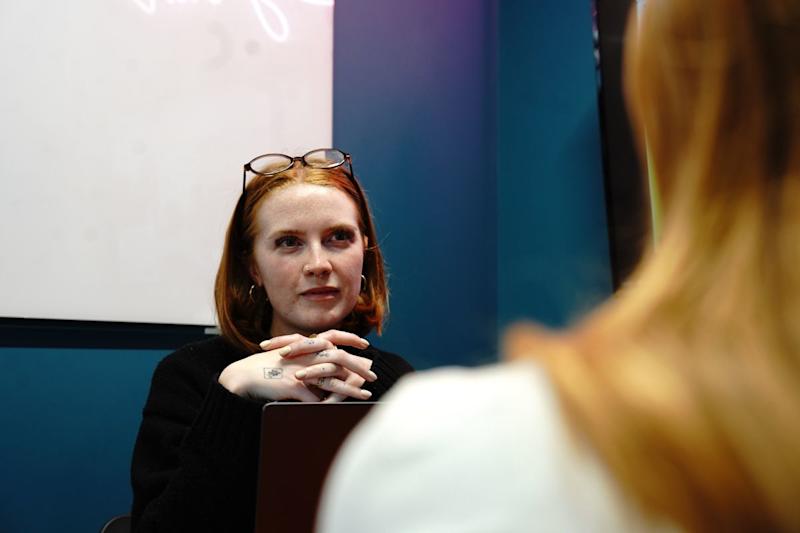 A member of Anna Freud staff facing another colleague.