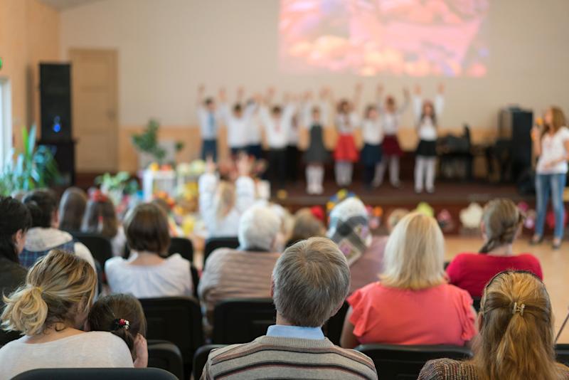 Parents at a concert at children in a kindergarten