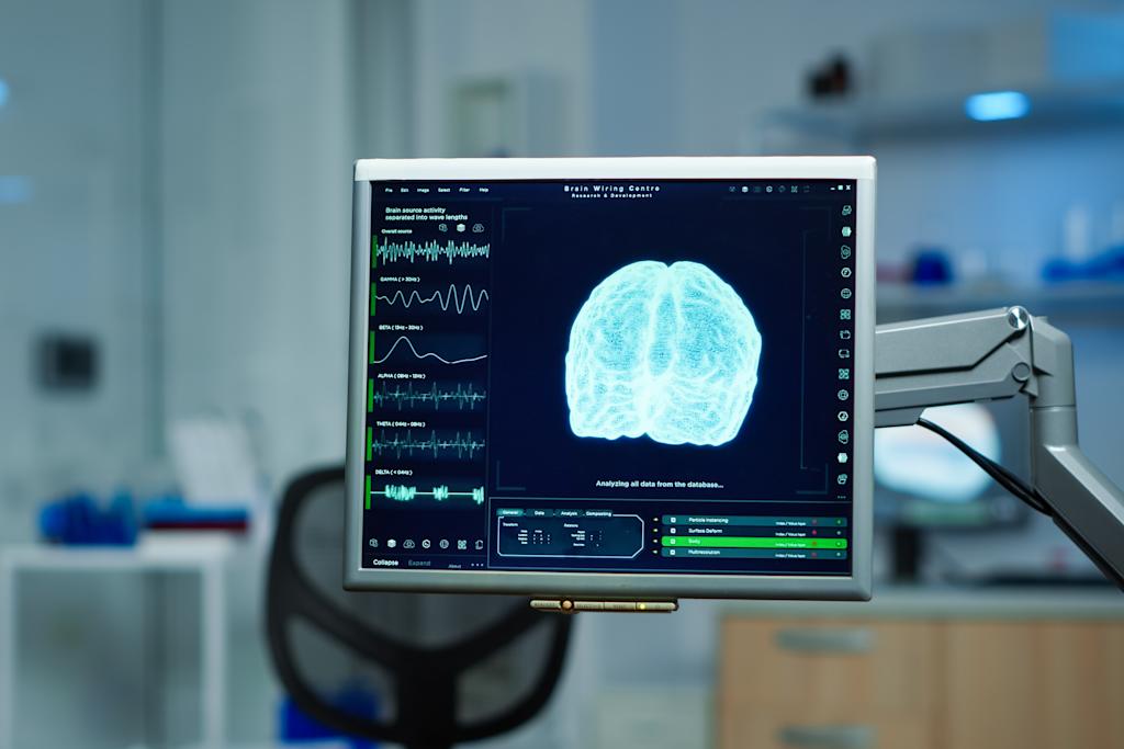 Interior of empty science laboratory with modern equipment. A scan of the brain is shown on the screen.