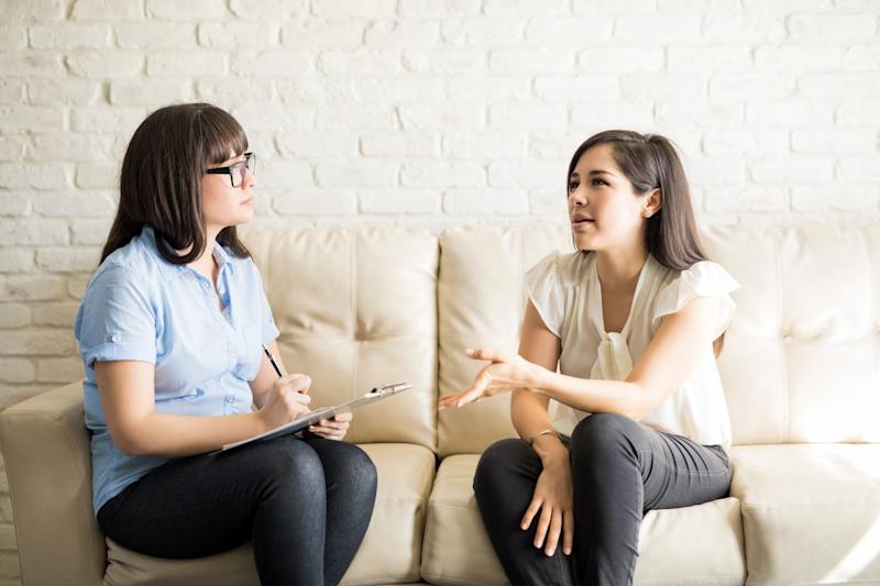 women talking on sofa