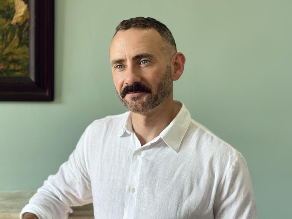 Eamon McCrory, Chief Executive of Anna Freud, photographed facing forward and looking to the side.