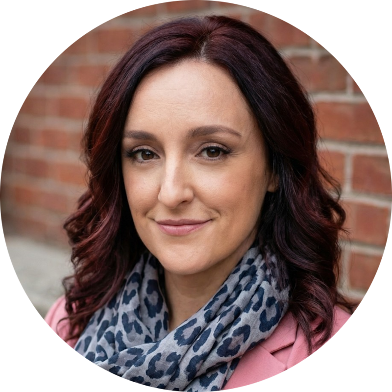 Dr Kate Ward, headshot smiling against a wall.