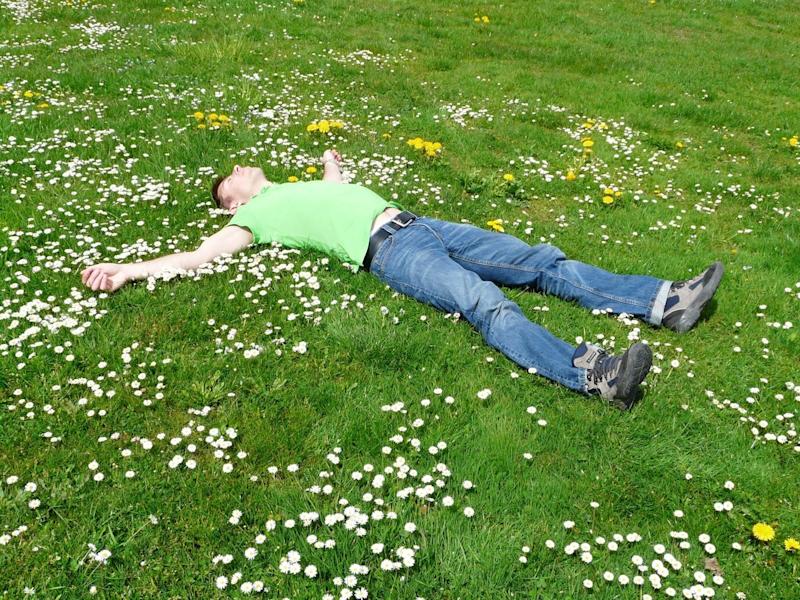 man lying on grass