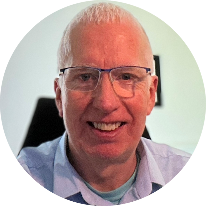 Headshot of David Rawlinson, looking into the camera, smiling.