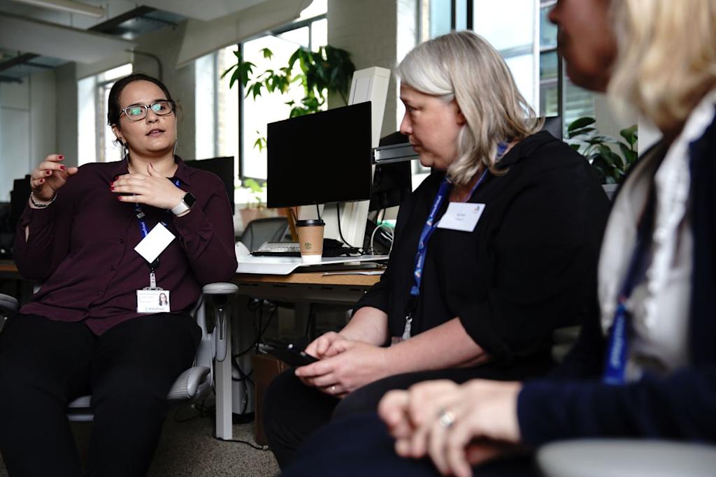 Three Anna Freud staff having a discussion in office.