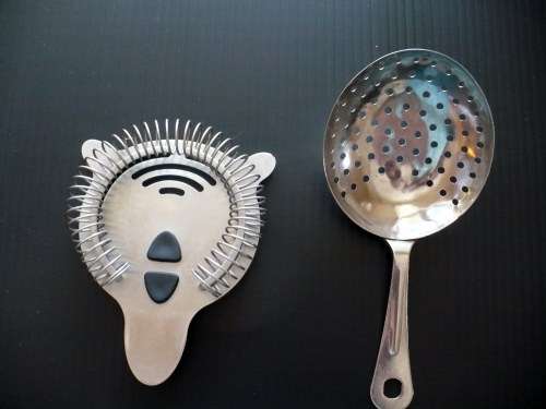 A stainless steel cocktail strainer set