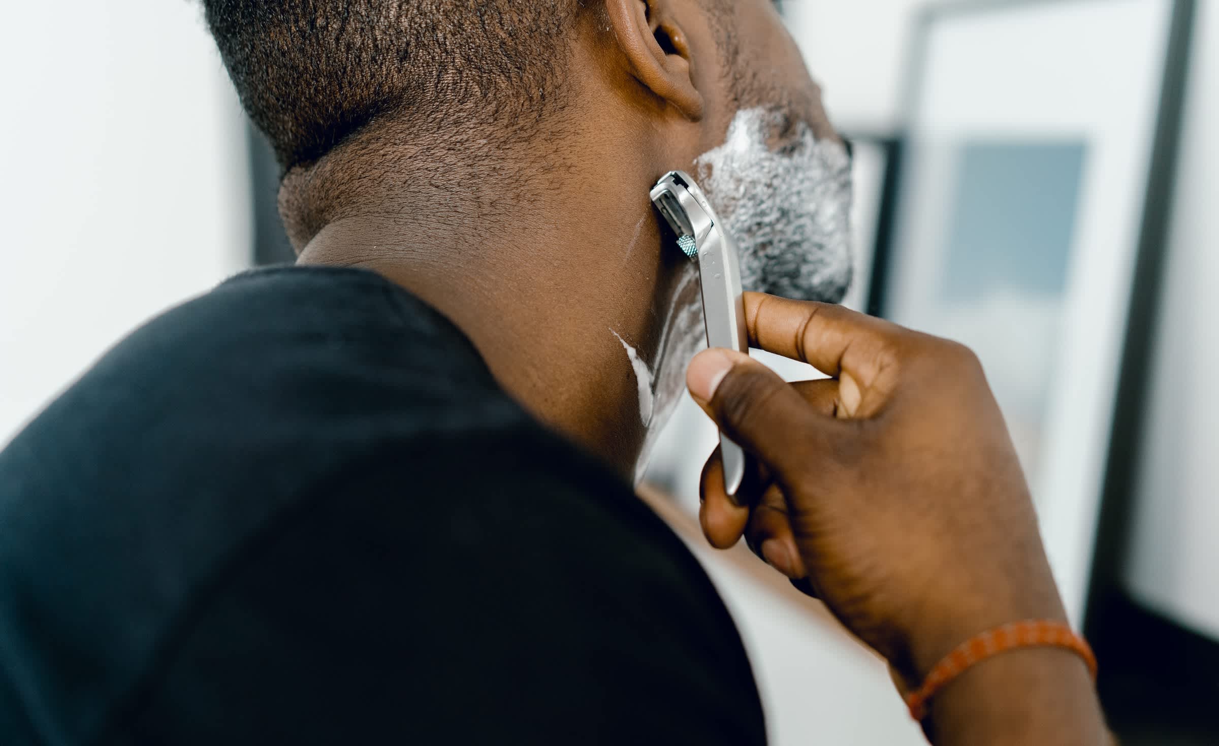 Man shaving with a razor blade