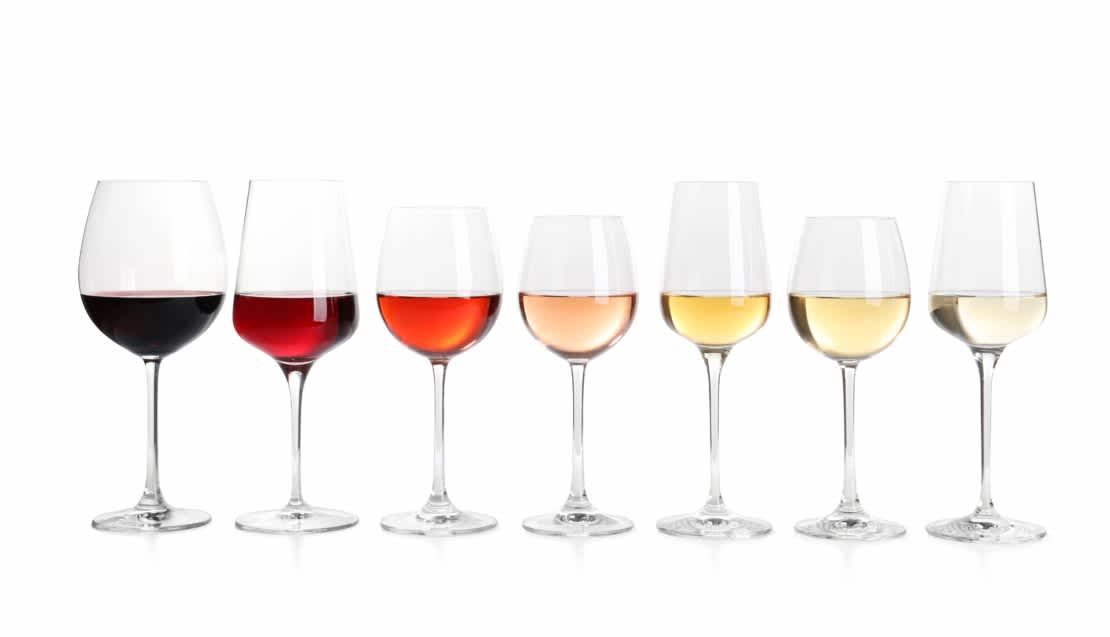 Row of glasses with different wines