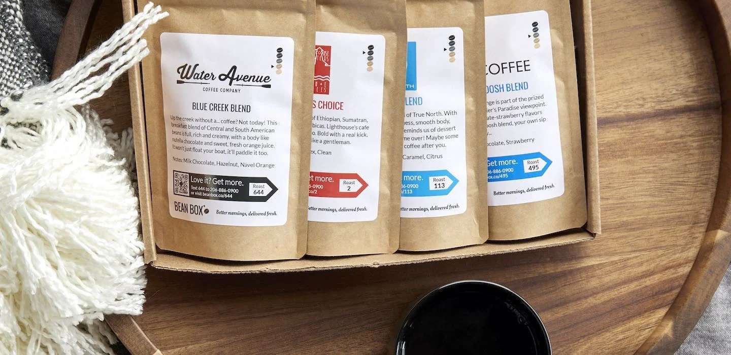 Photo of four different coffees in a subscription box from Bean Box