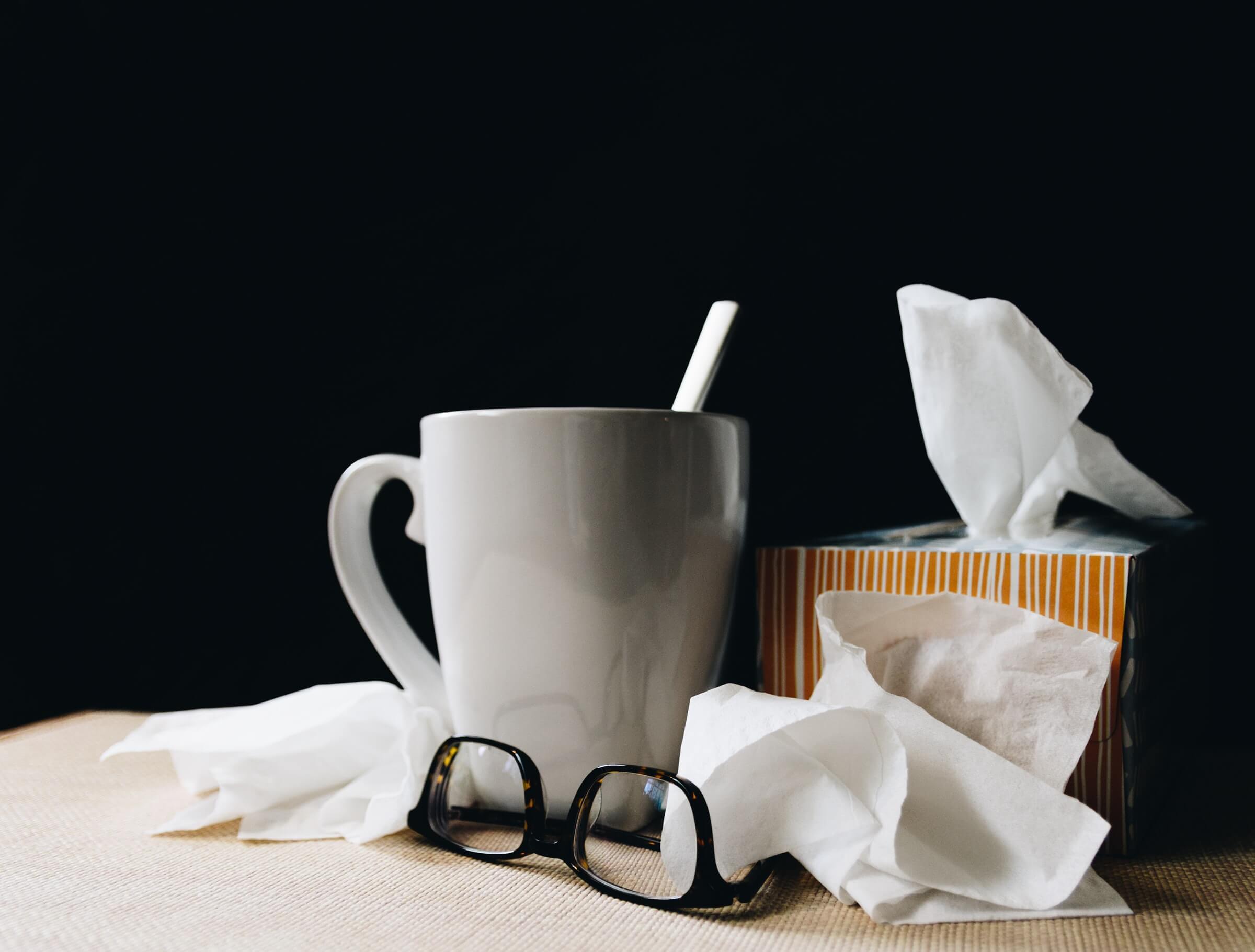 tissues, mug and glasses on table for allergy relief benadryl alternative