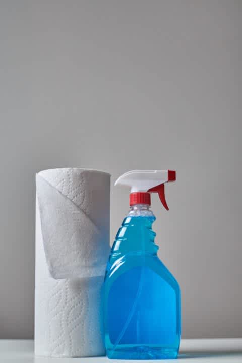 Paper towels and bottle of cleaner