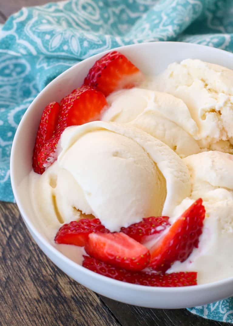 Homemade vanilla ice cream topped with strawberries