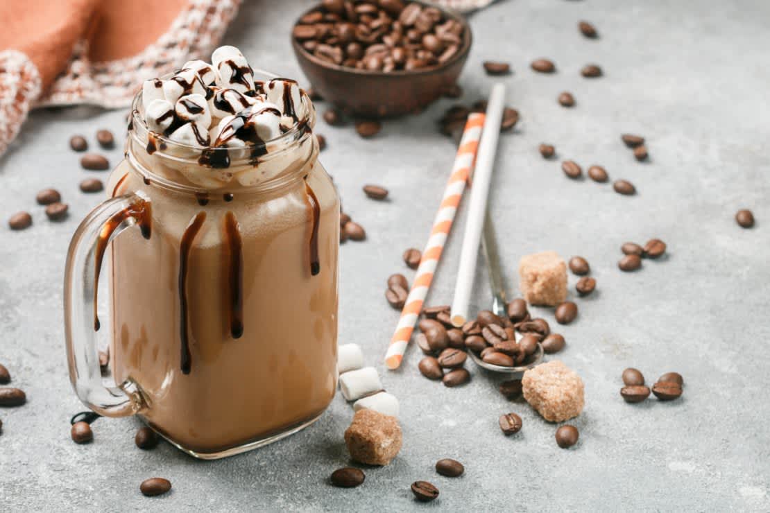 Chocolate frappe coffee with marshmallows and syrup in a Mason jar