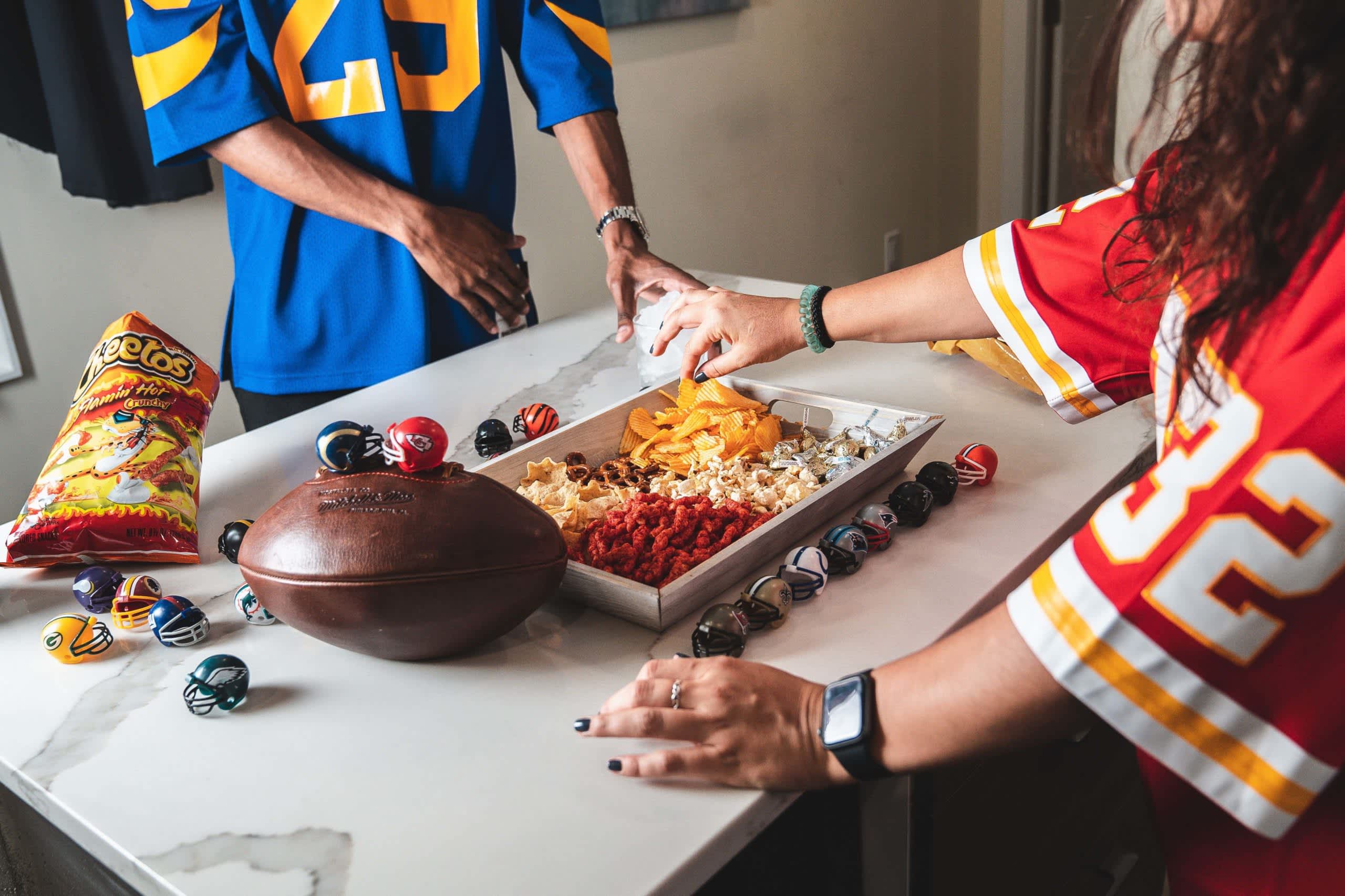 Gopuff game day with various snacks around a football tailgate spread