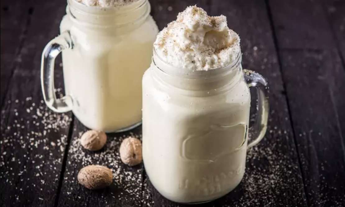 Chilled eggnog with whipped cream