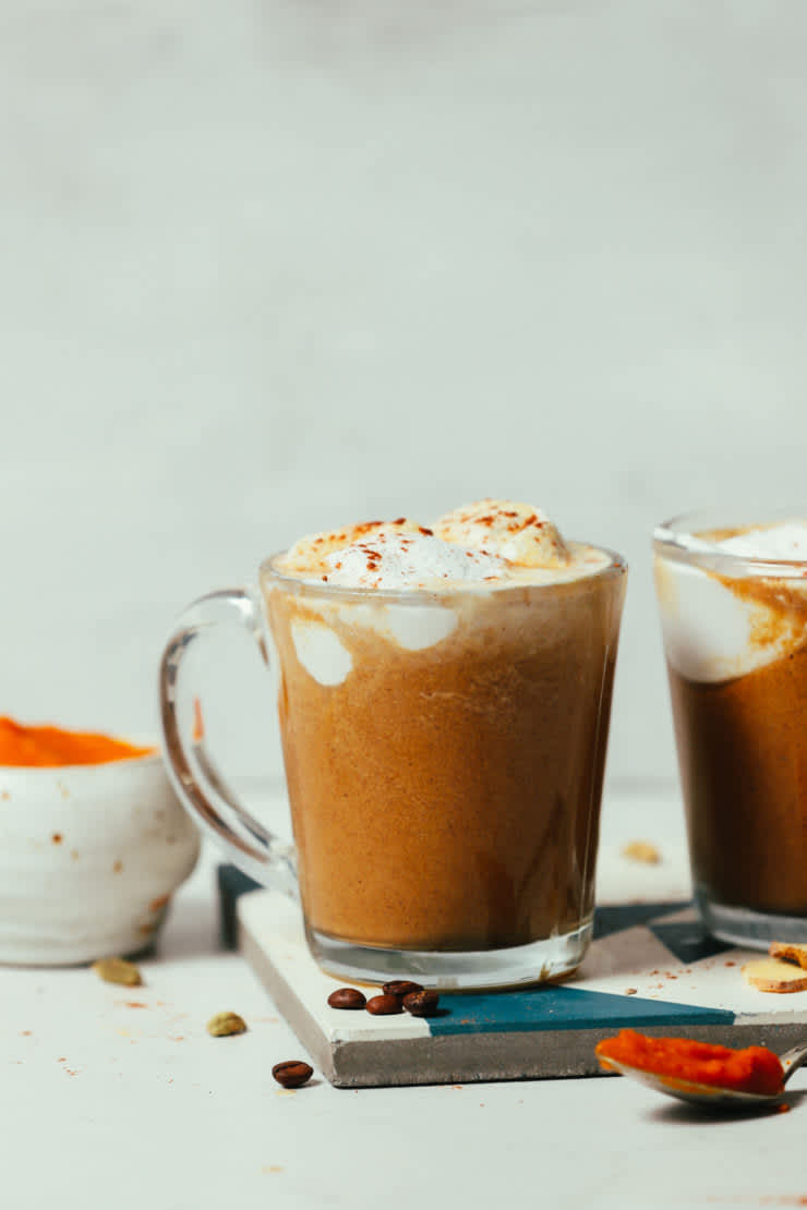 An easy pumpkin spice latte topped with whipped cream in a glass mug