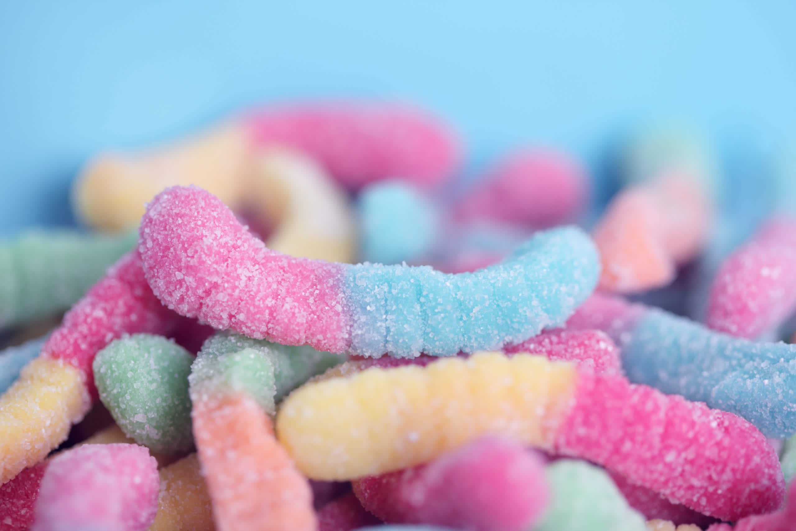 A pile of sour gummy worms