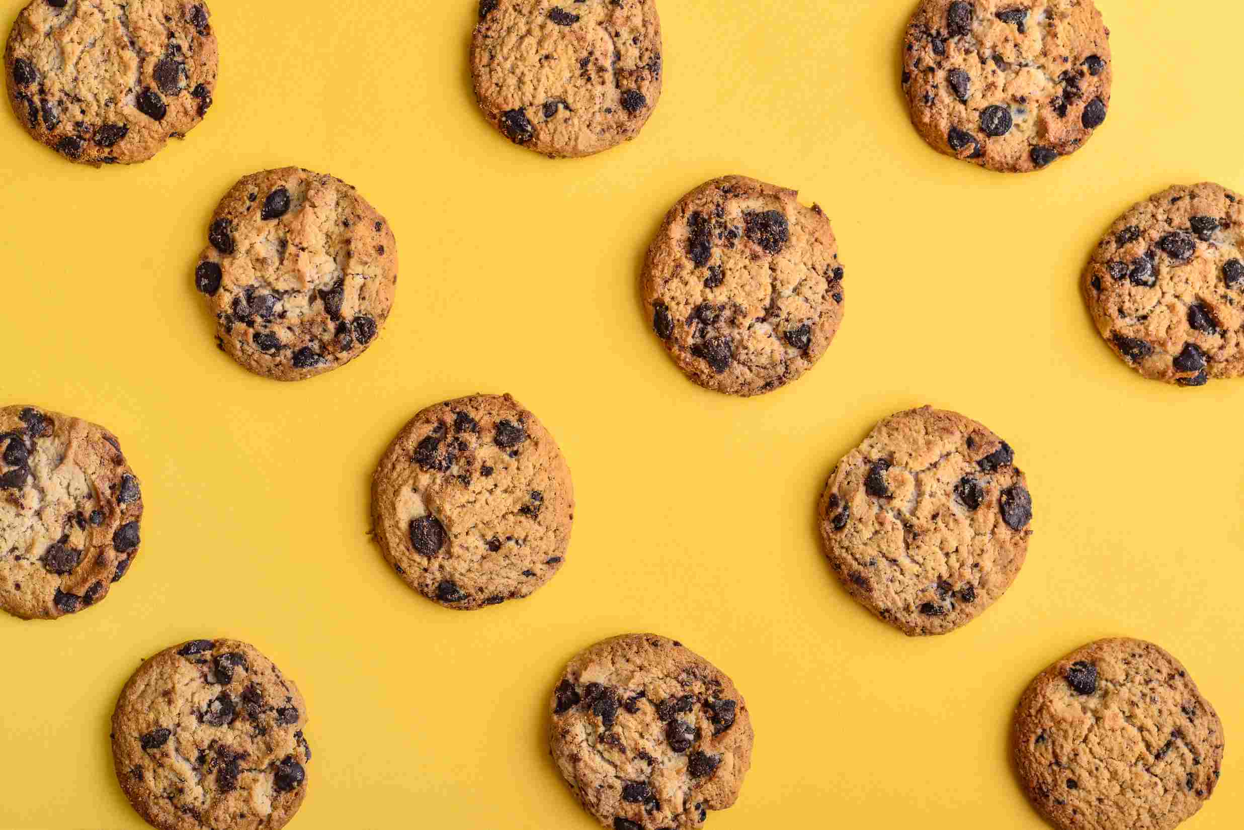 Chocolate chip cookies on yellow background