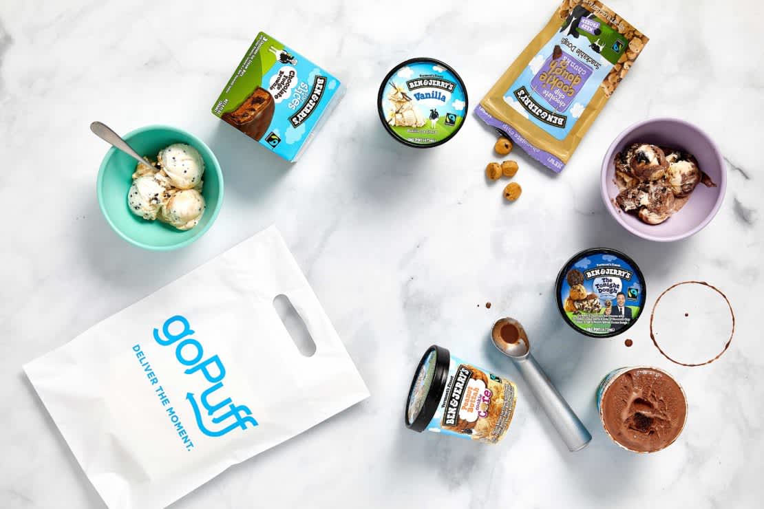 A spread of various Ben & Jerry's ice cream products next to a Gopuff bag