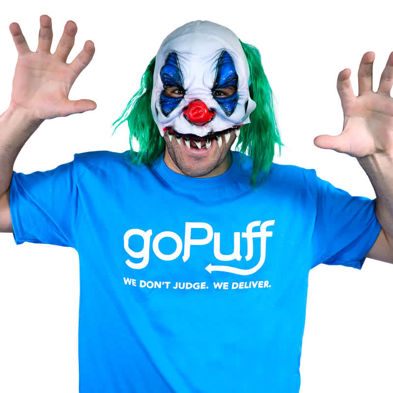 Man in Gopuff tee wearing scary clown mask