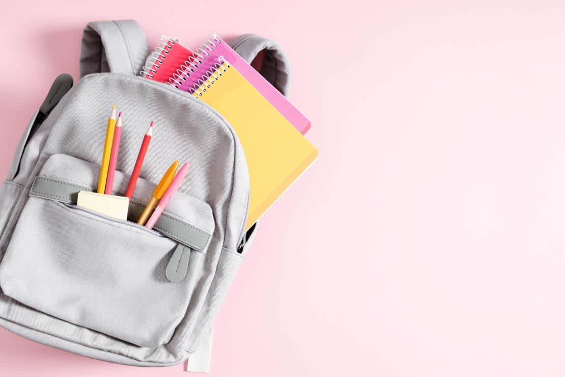 open backpack with school supplies