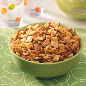 Party mix in a green bowl