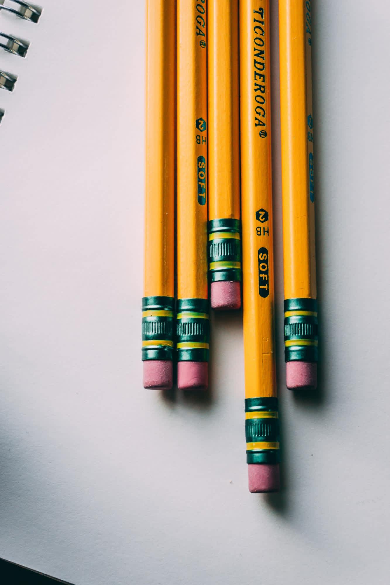 Pencils in a row on a notebook