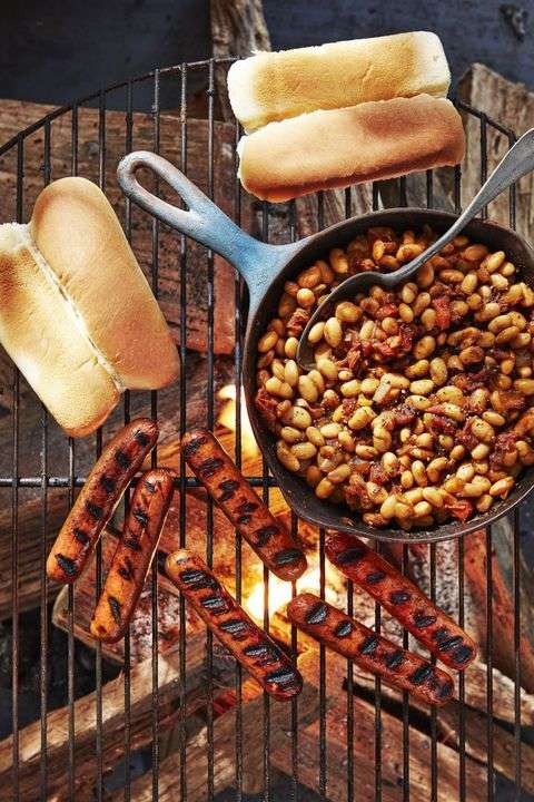 Hot dogs with quick beans cooked on a cast iron skillet