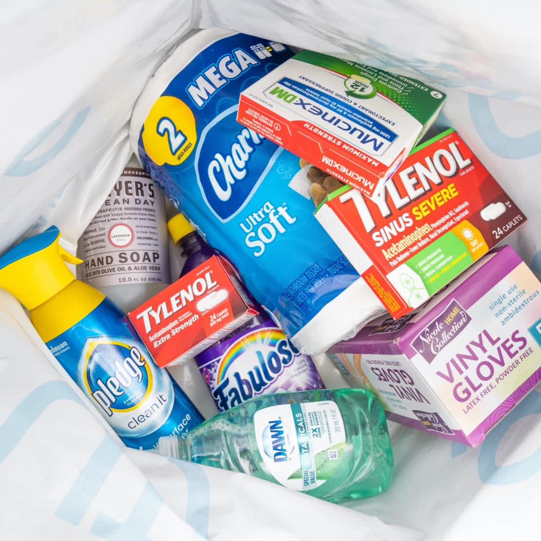 An array of cleaning and cold & flu products packed in a Gopuff bag