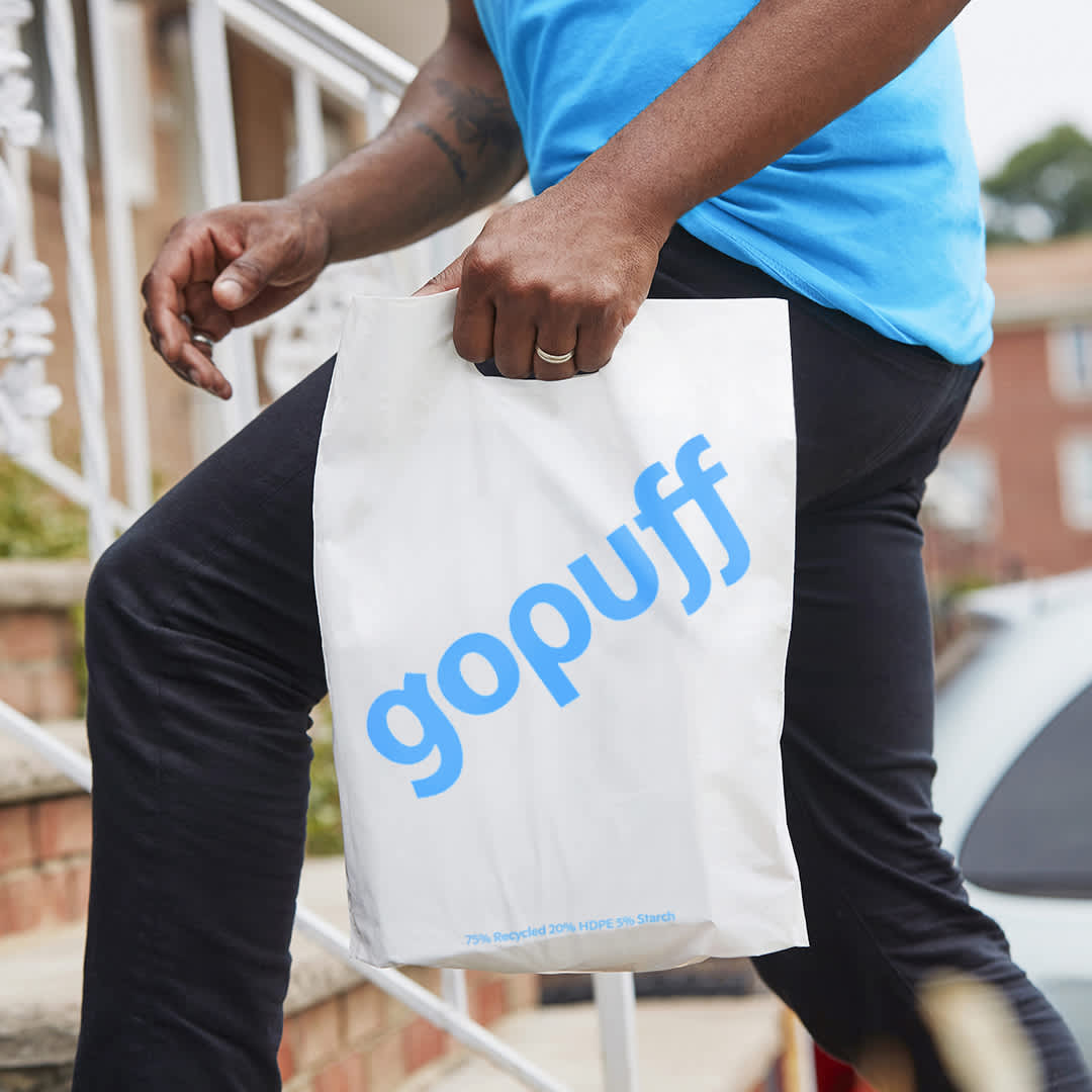 Man with white bag with Gopuff logo