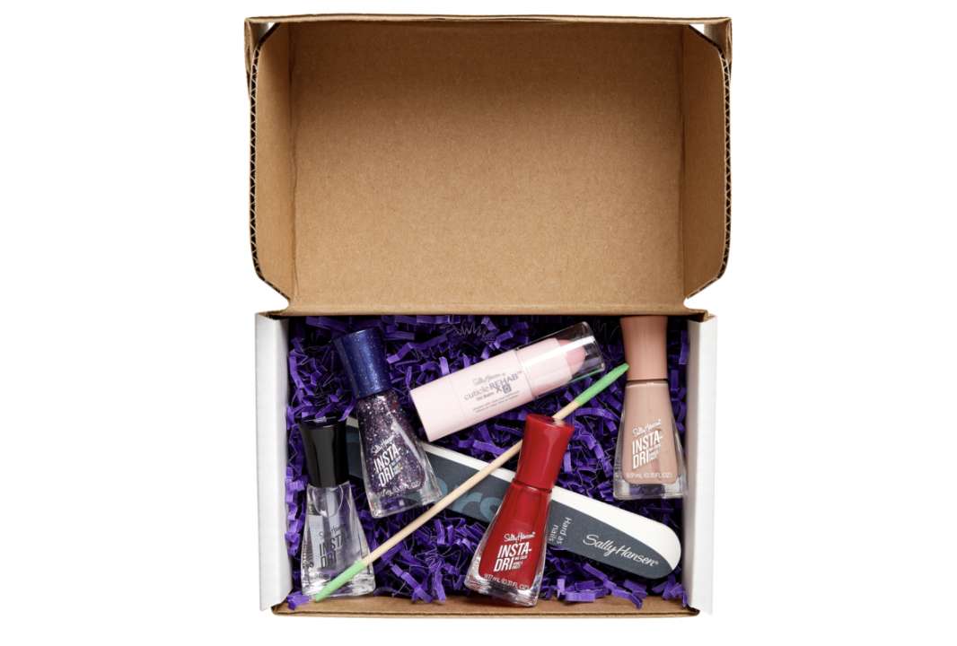 Sally Hansen mani-pedi box full of nail polish, nail file and other tools