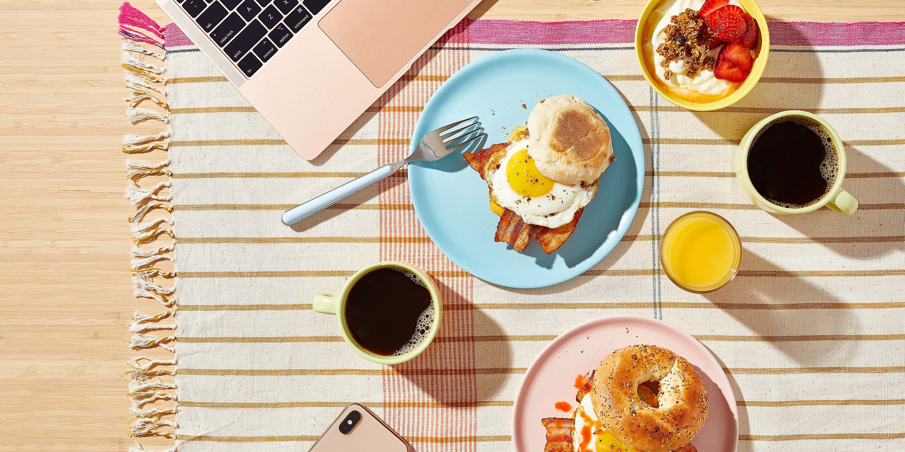 Breakfast picnic - a blanket with food and coffee on it
