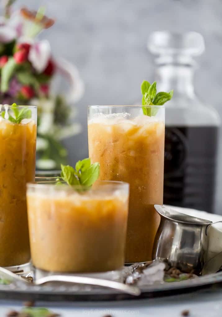 Short & tall glasses with coconut milk Thai iced coffee on tray