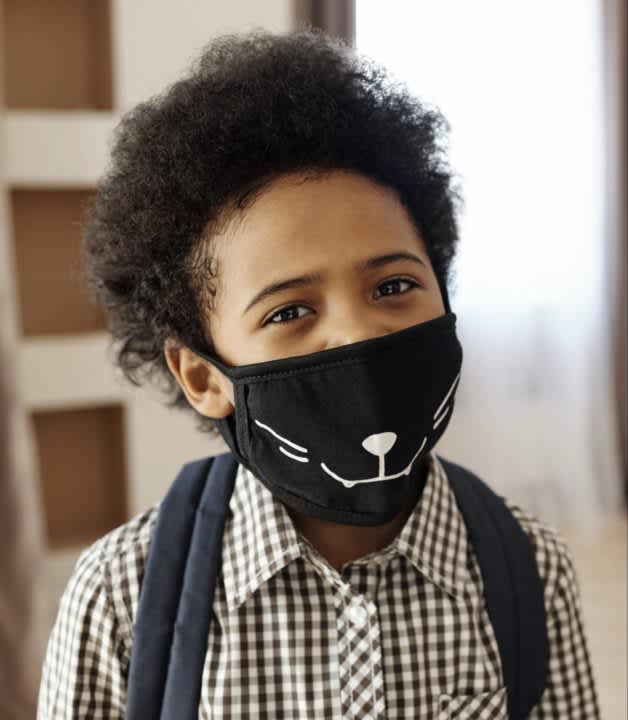 School student with cat facemask