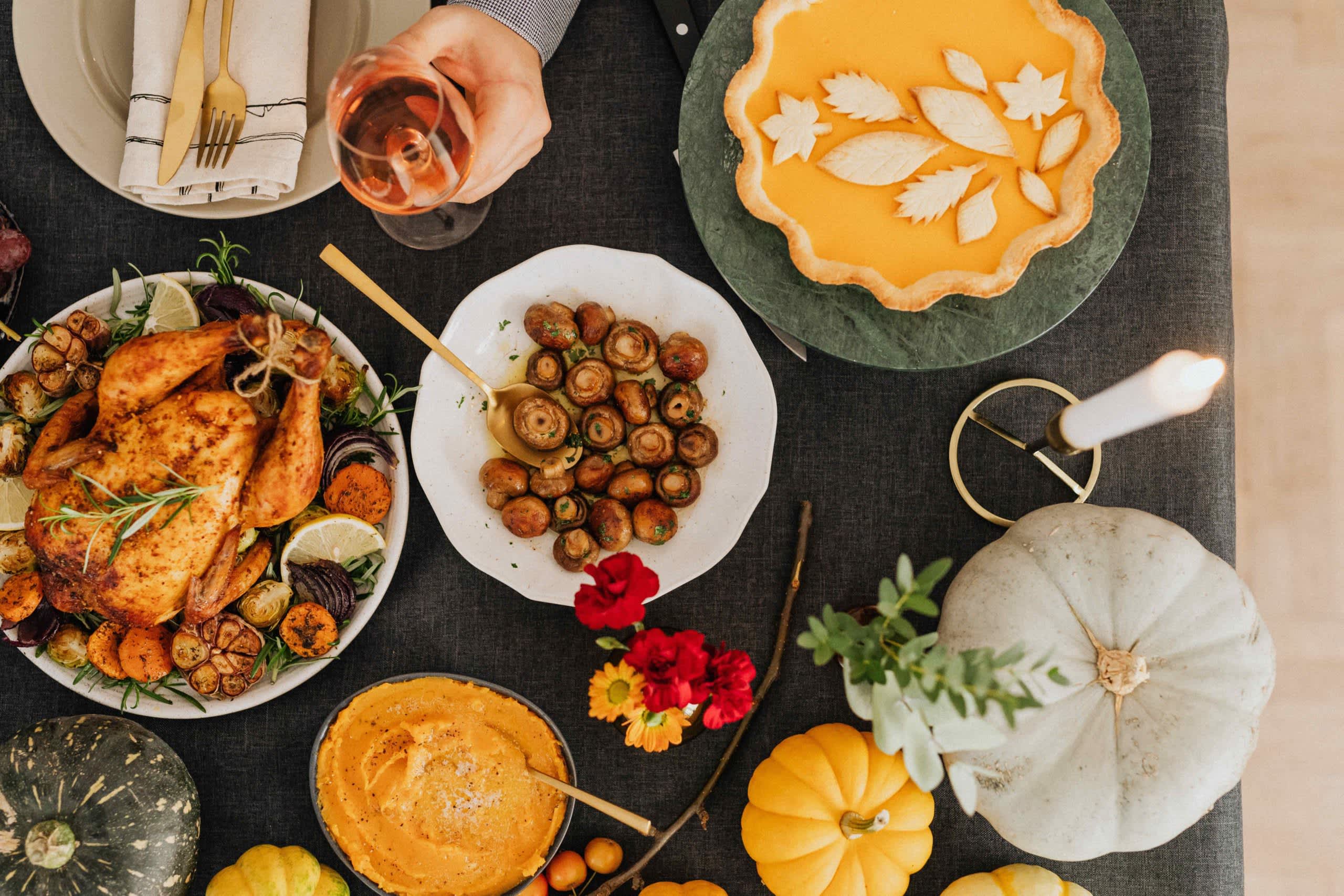 A Thanksgiving table spread with dinner and sides