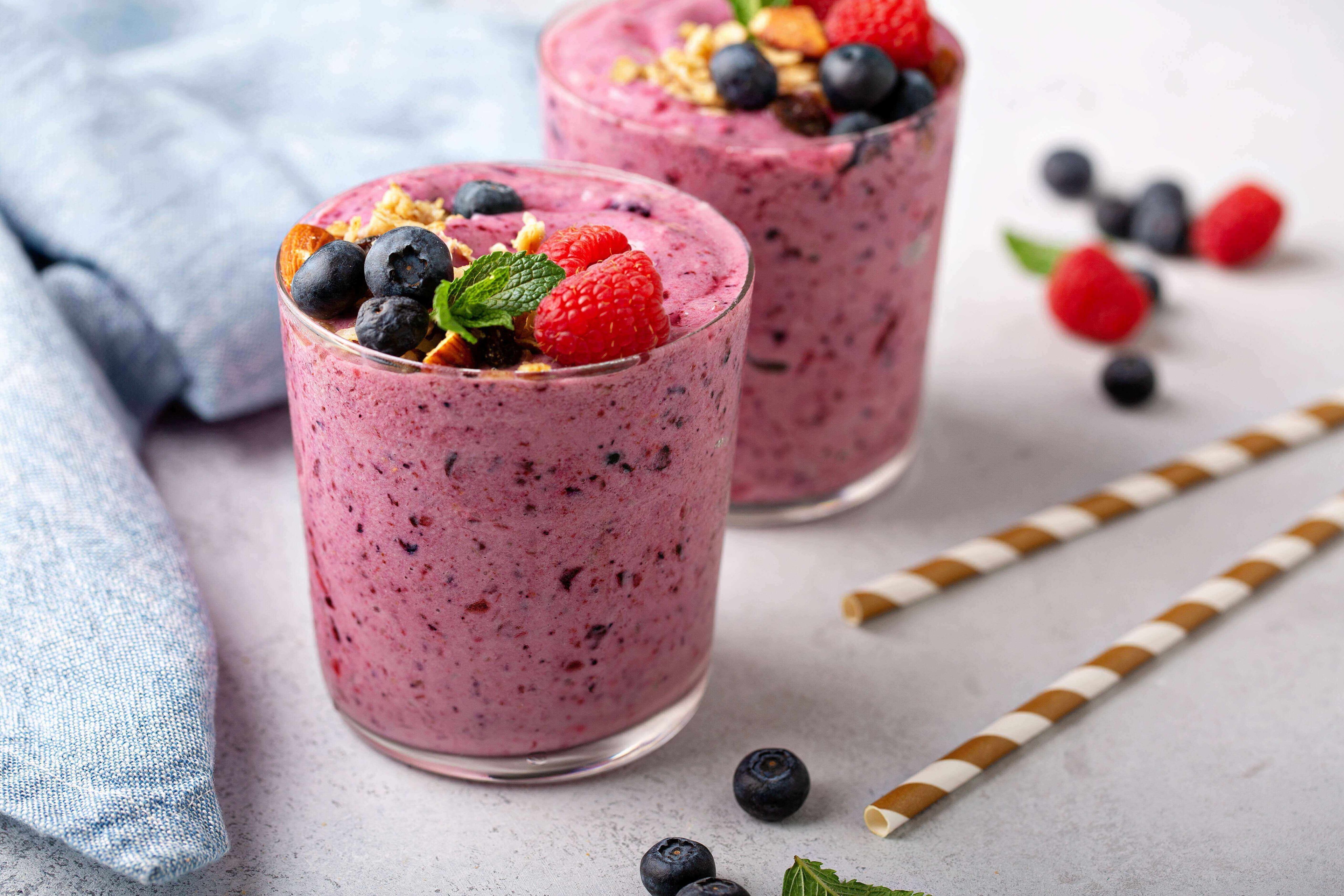 Fresh mixed berry smoothie topped with granola