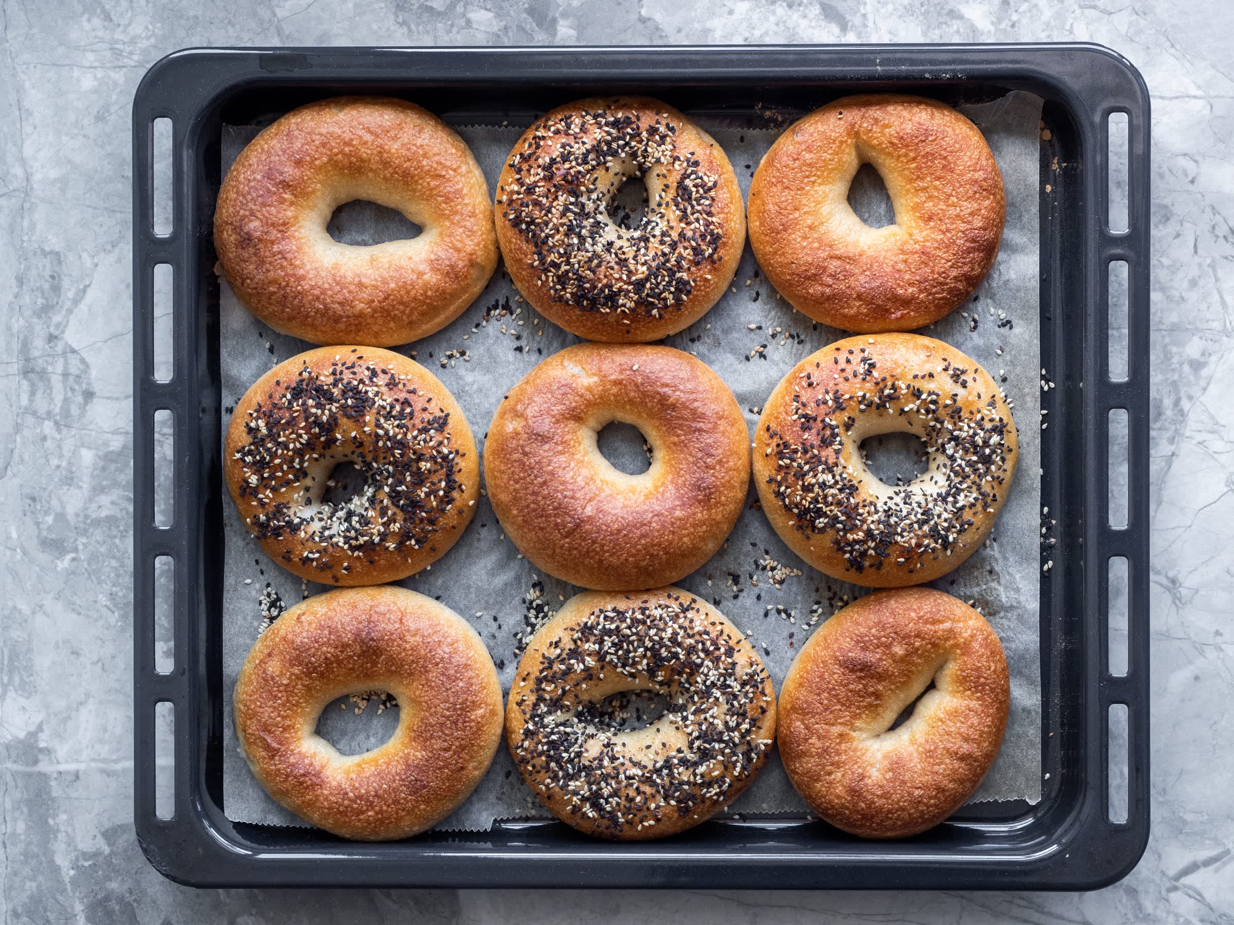 Sourdough store-bought bagels on oven tray