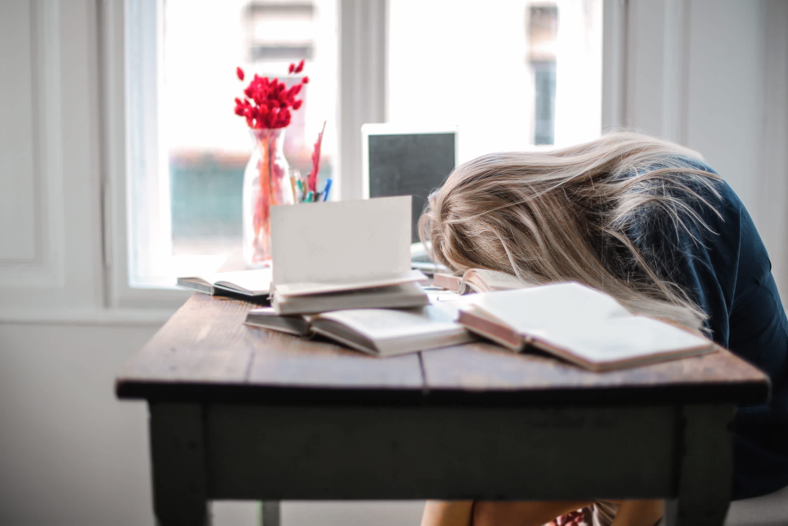 Woman leaning on table after a tough work week