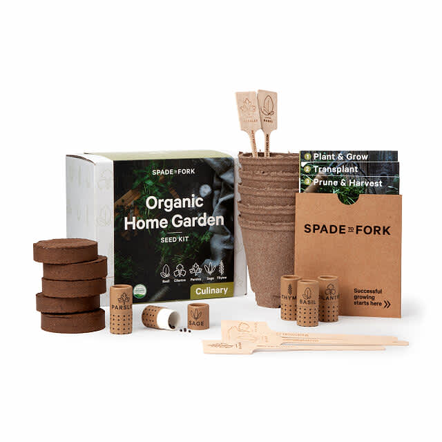 Organic home garden kit with a box, signs, pots, instructions and tools