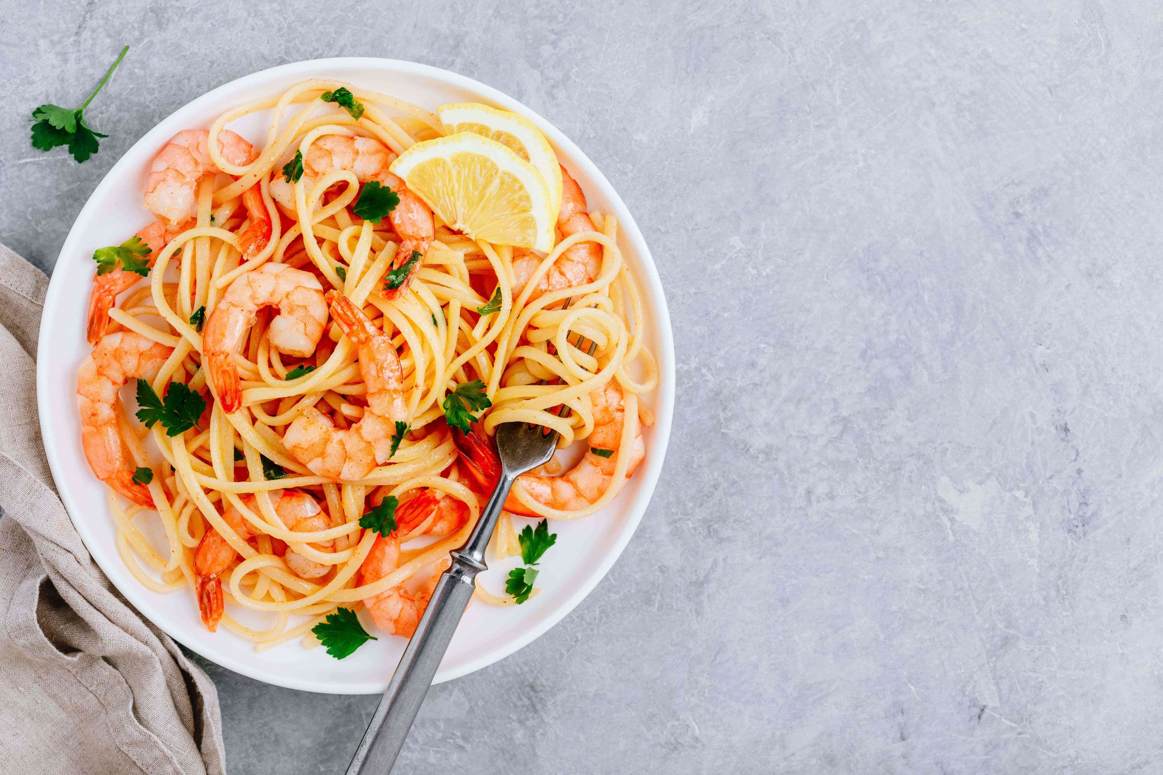 61bcbd41125a817827bd7efe_Seafood%20Pasta%20spaghetti%20with%20shrimps%20and%20parsley%20on%20gray%20stone%20background.jpeg