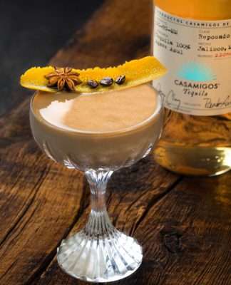 Casamigos Tequila coffee cocktail, garnished with orange peel, anise, and coffee beans